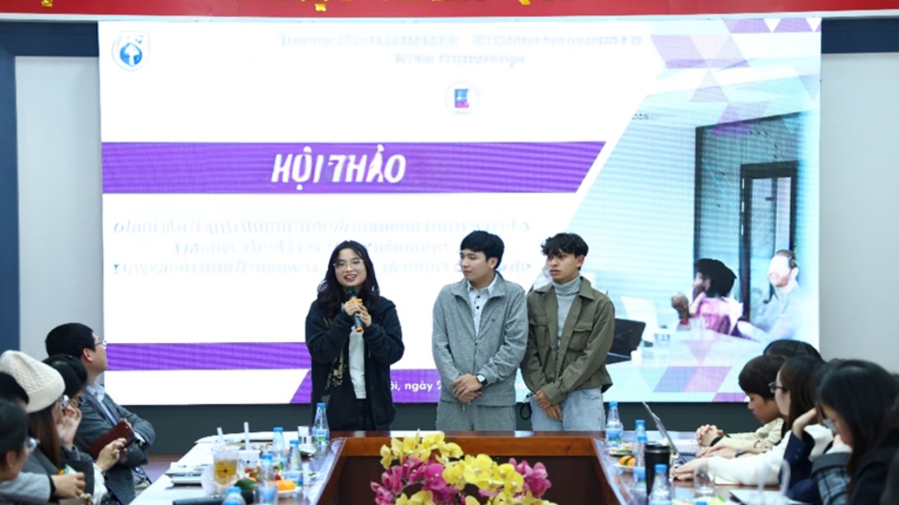 A group of people standing in front of a large screen AI-generated content may be incorrect.