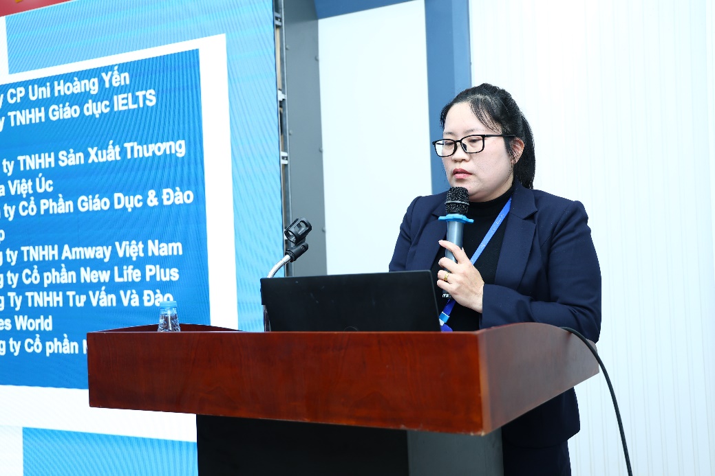 A person standing at a podium holding a microphone AI-generated content may be incorrect.