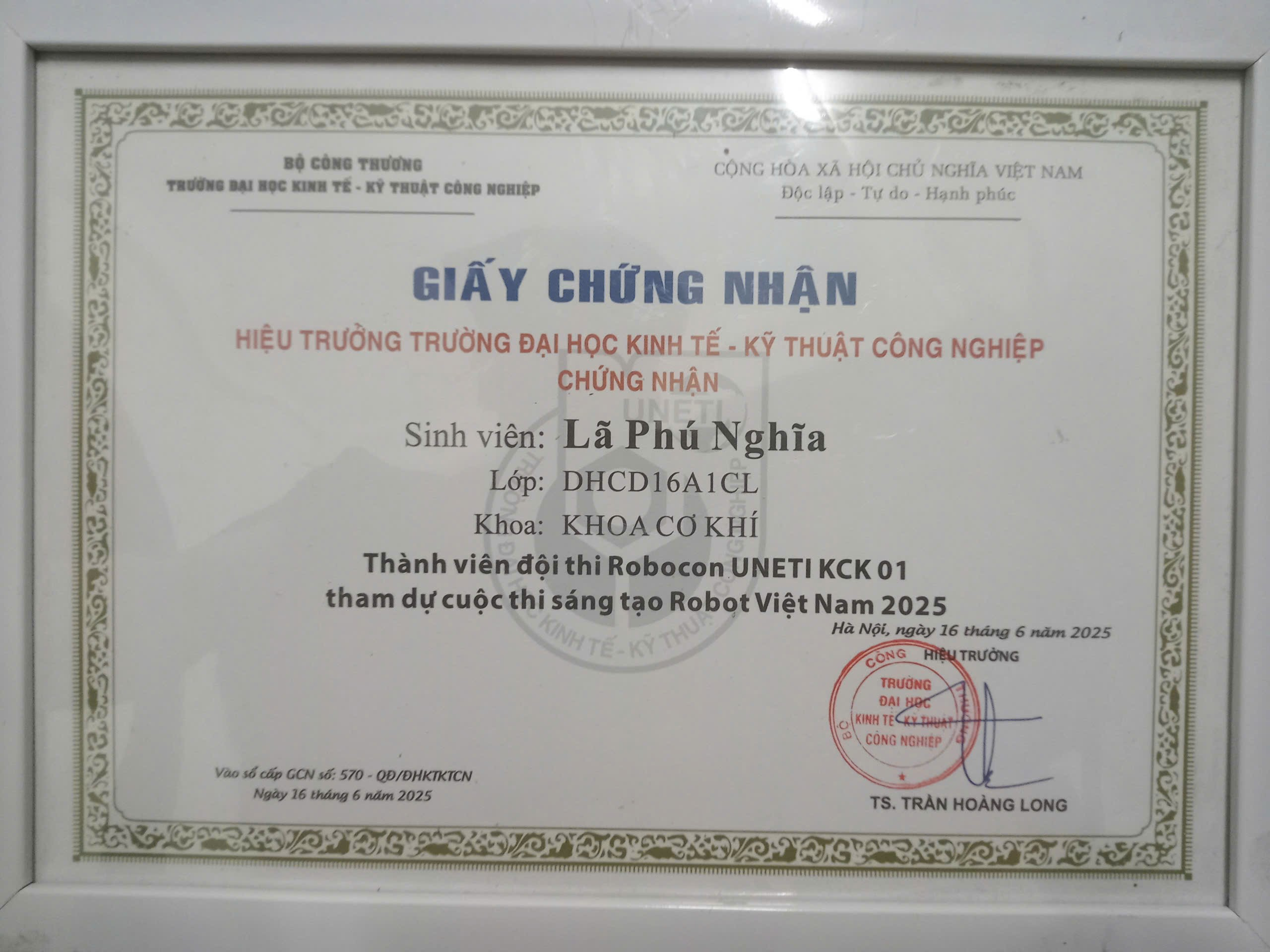 A certificate with a stamp on it Description automatically generated