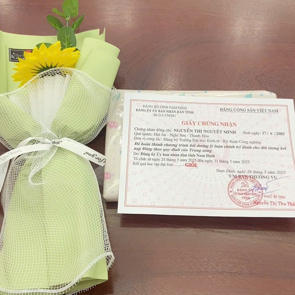 A gift wrapped in a tulle bag next to a card AI-generated content may be incorrect.