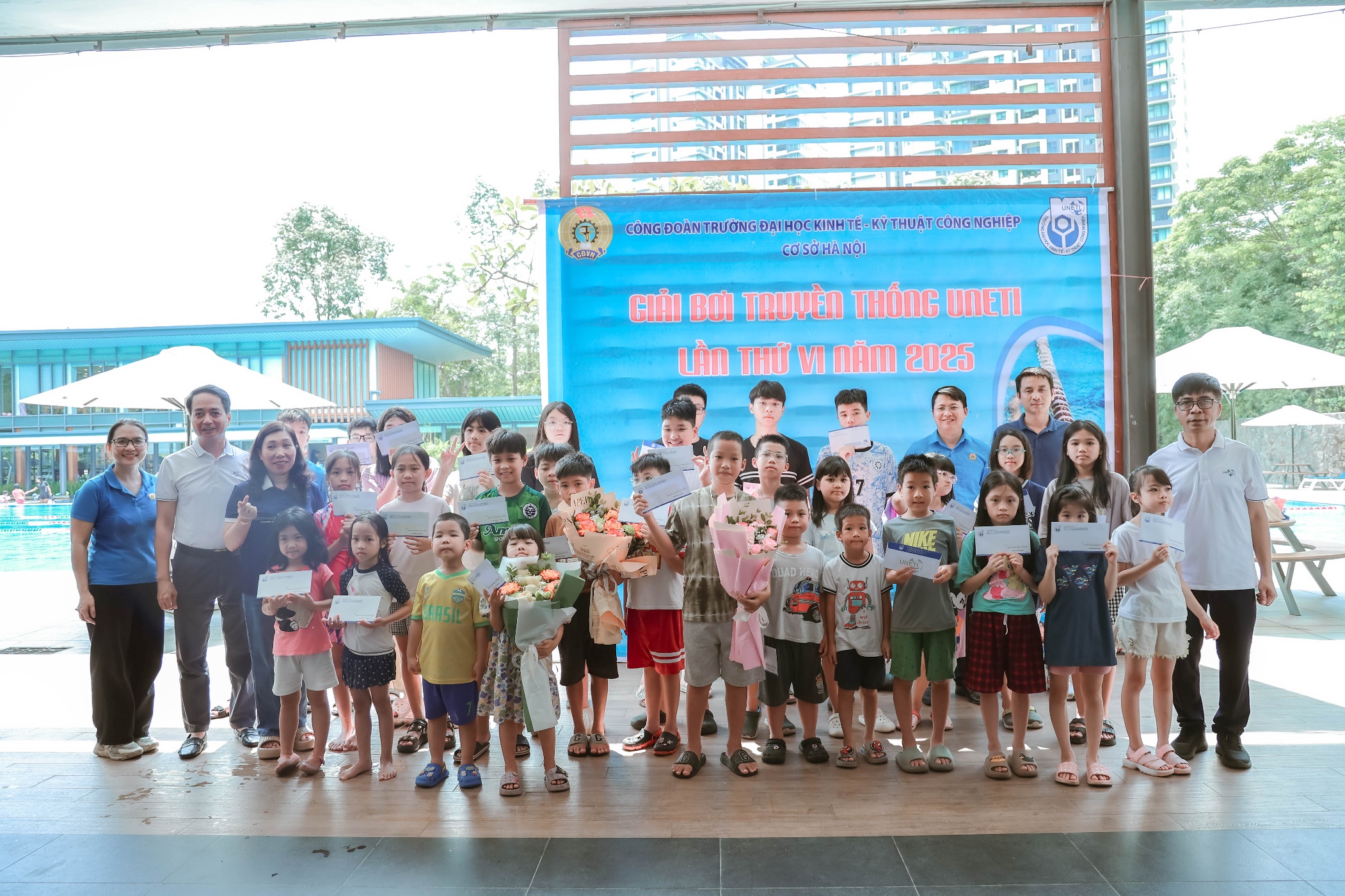 A group of children holding signs Description automatically generated