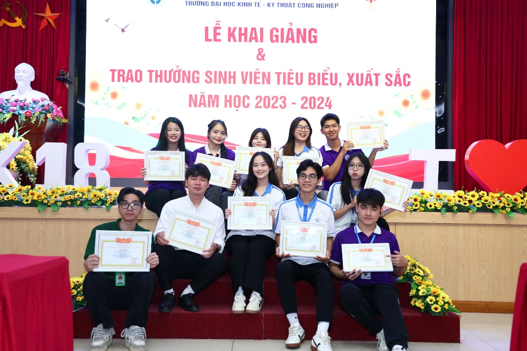 A group of people holding certificates AI-generated content may be incorrect.