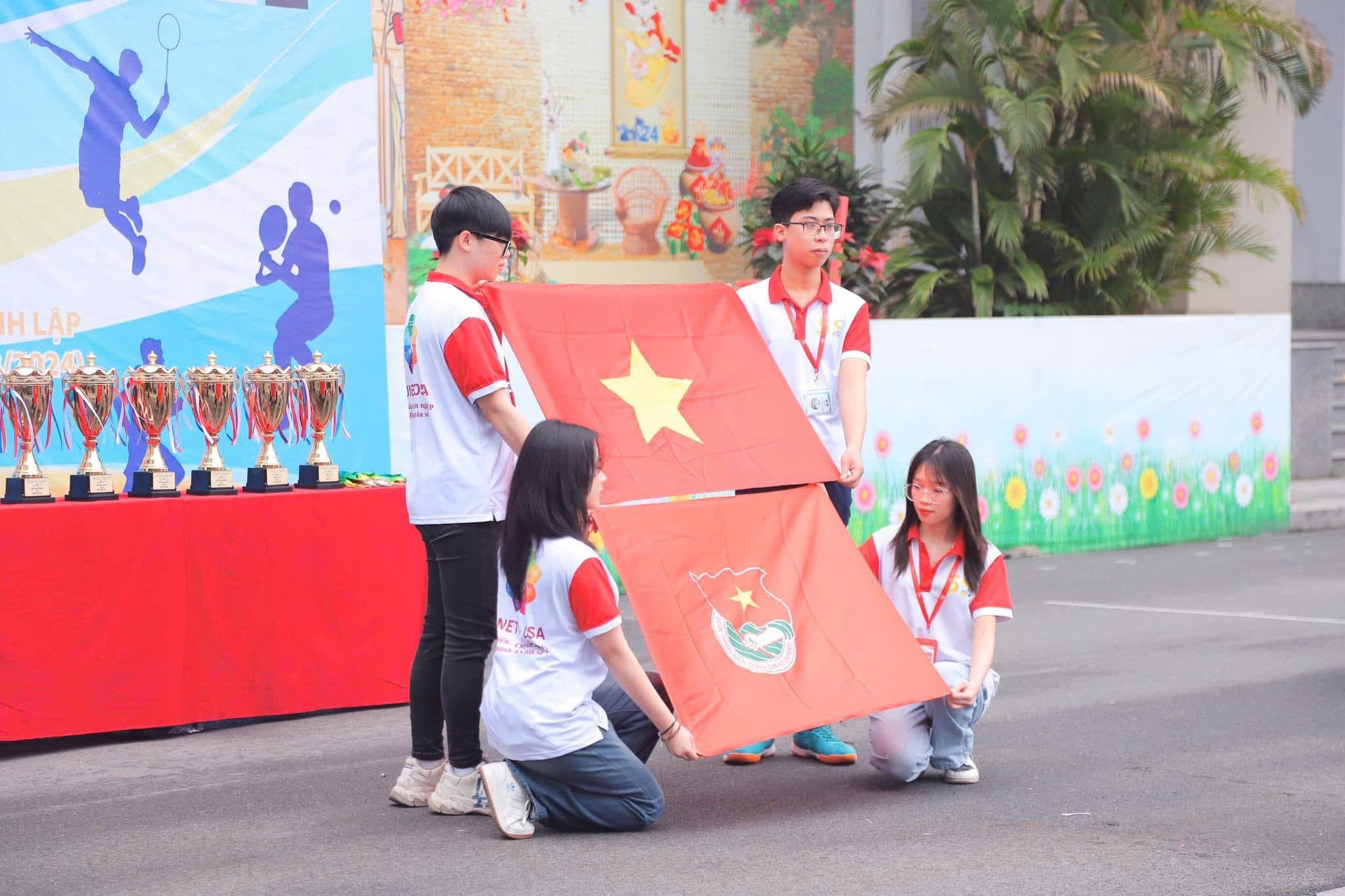 A group of people kneeling on the street holding a flag AI-generated content may be incorrect.