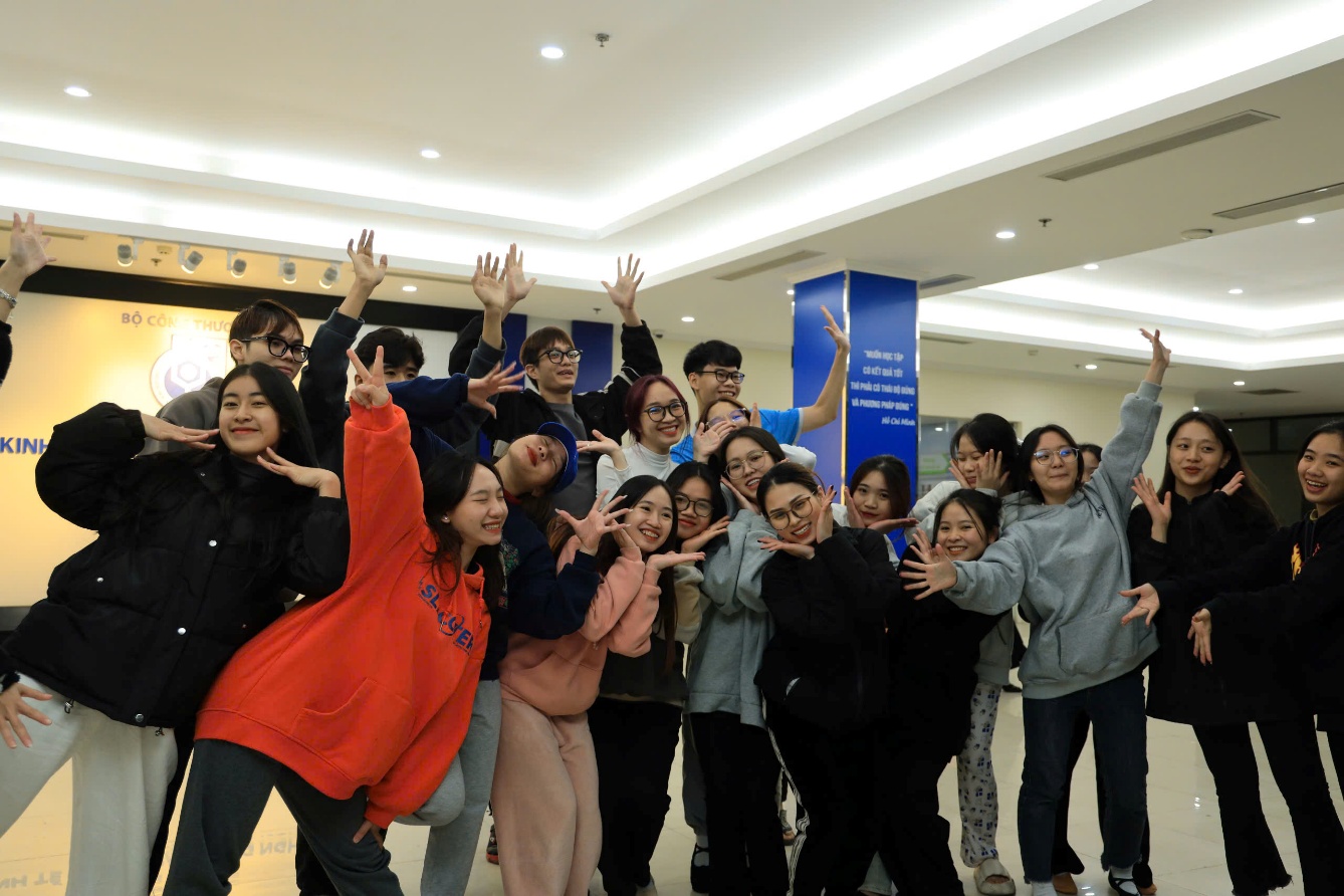 A group of people posing for a photo AI-generated content may be incorrect.