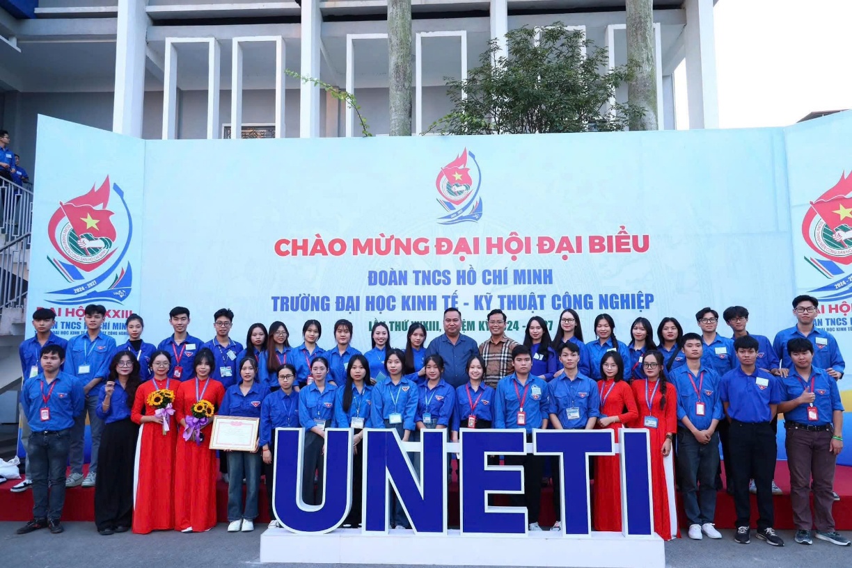 A group of people posing for a photo Description automatically generated