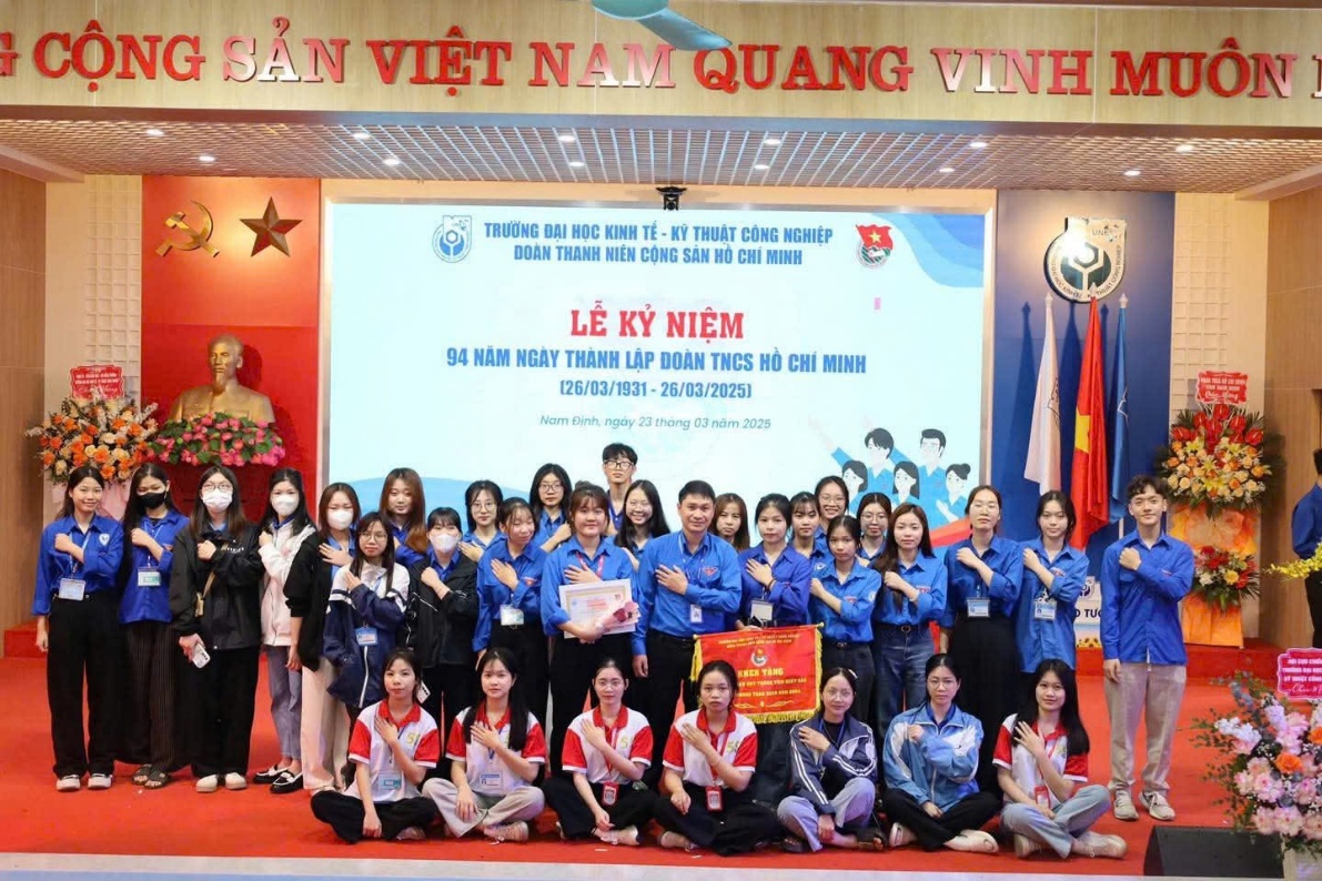 A group of people posing for a photo Description automatically generated