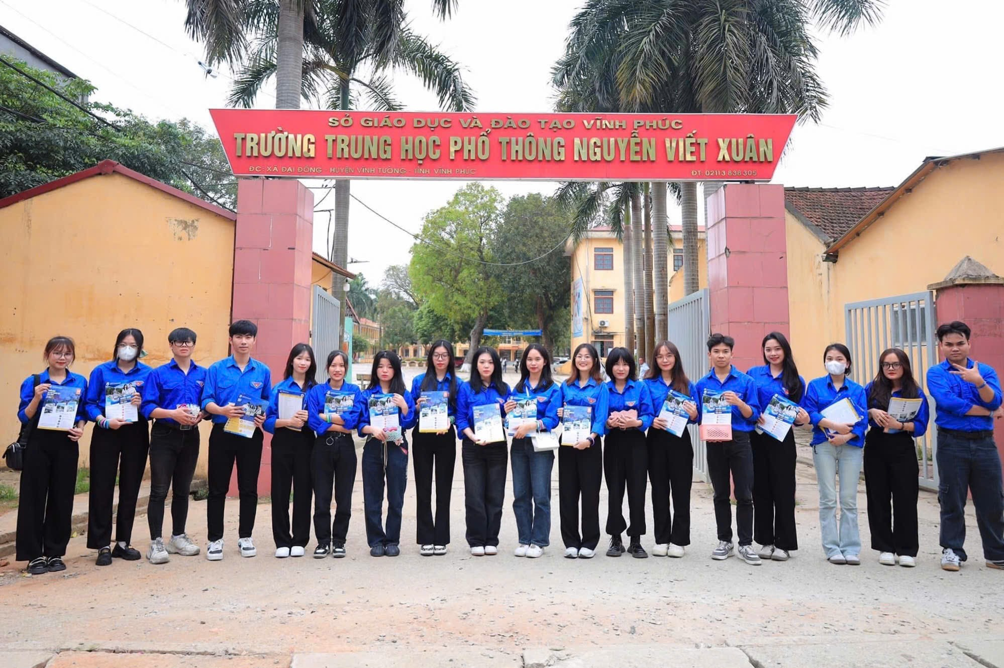 A group of people standing in front of a sign AI-generated content may be incorrect.