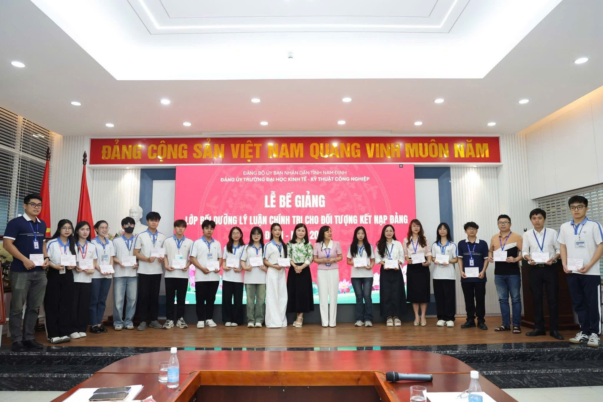 A group of people standing on a stage AI-generated content may be incorrect.
