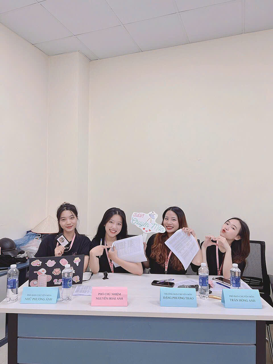 A group of women sitting at a table AI-generated content may be incorrect.