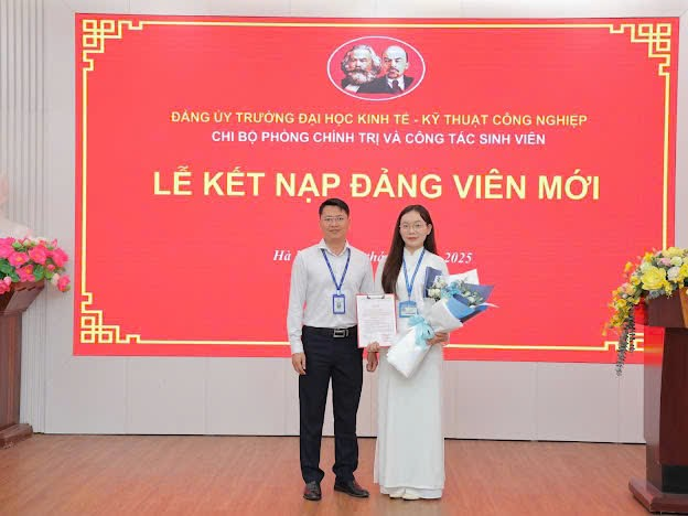 A person and person standing in front of a large sign

Description automatically generated