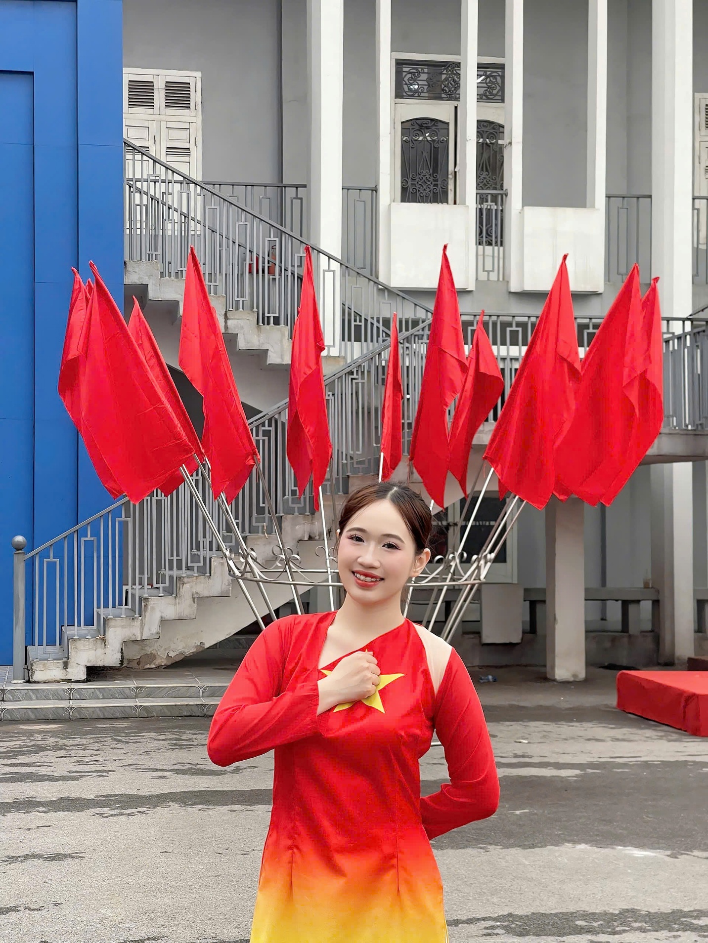 A person in a red dress holding red flags AI-generated content may be incorrect.