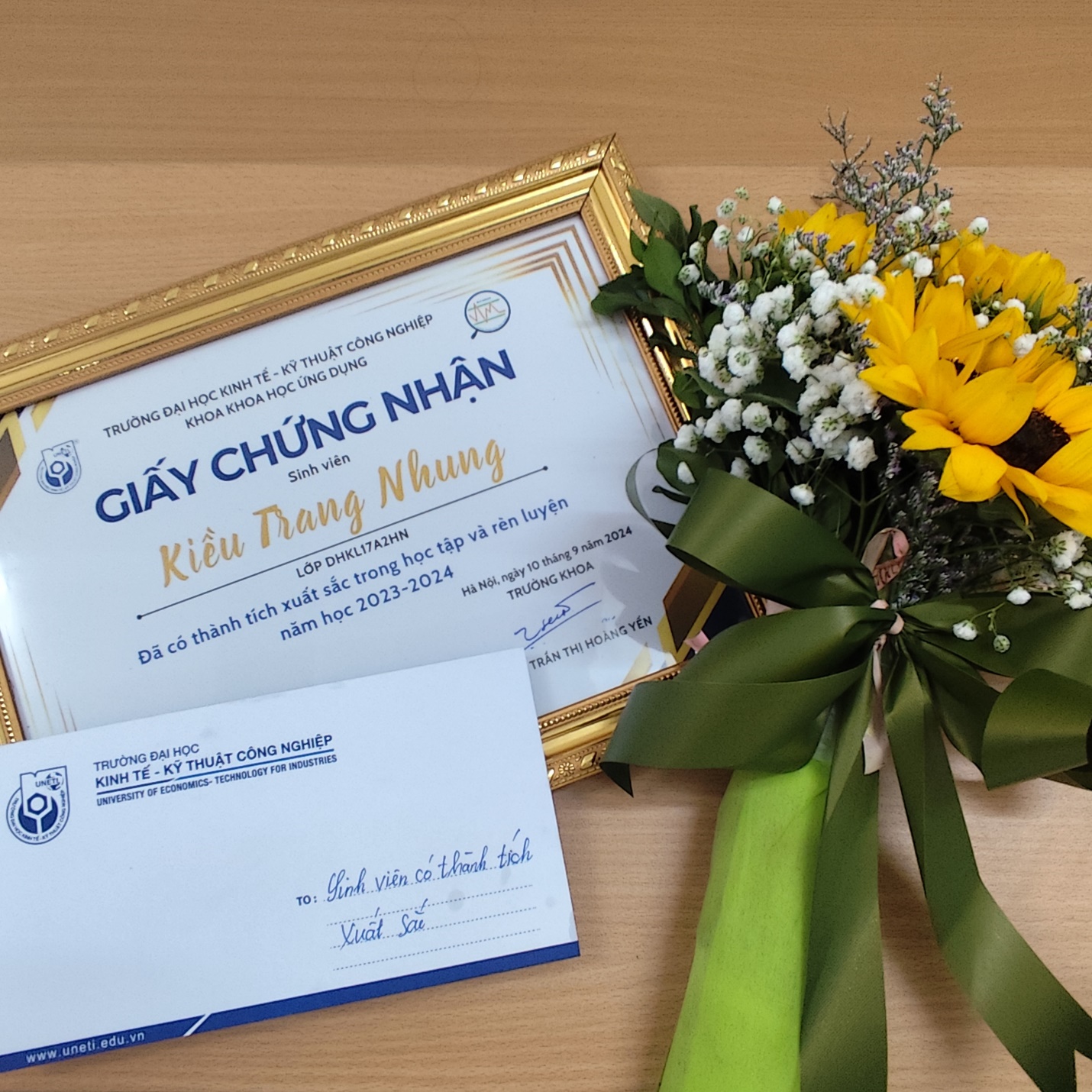 A frame with a bouquet of flowers and a certificate AI-generated content may be incorrect.