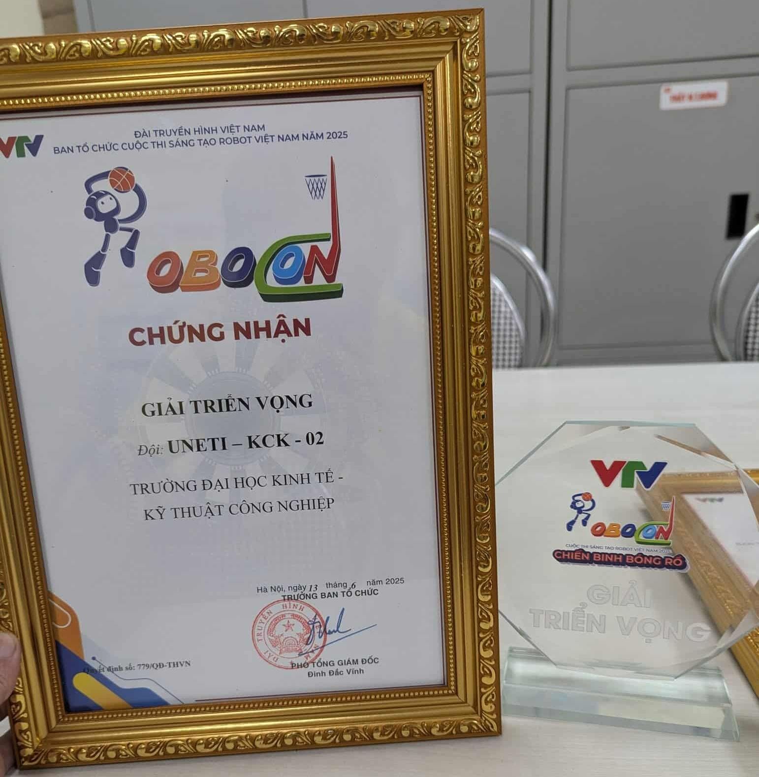A gold frame with a certificate and a glass case AI-generated content may be incorrect.