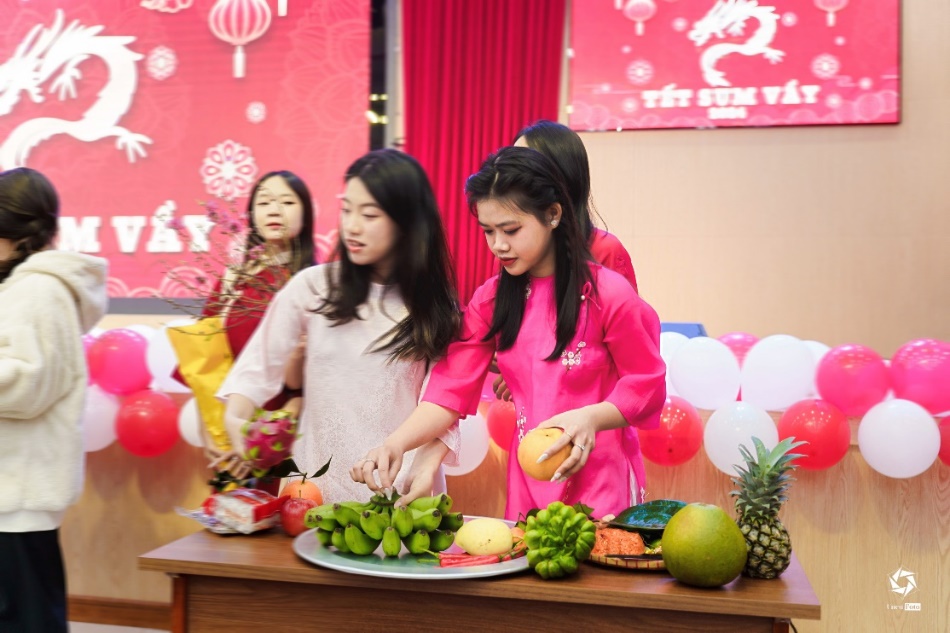 A group of women standing around a table with food AI-generated content may be incorrect.