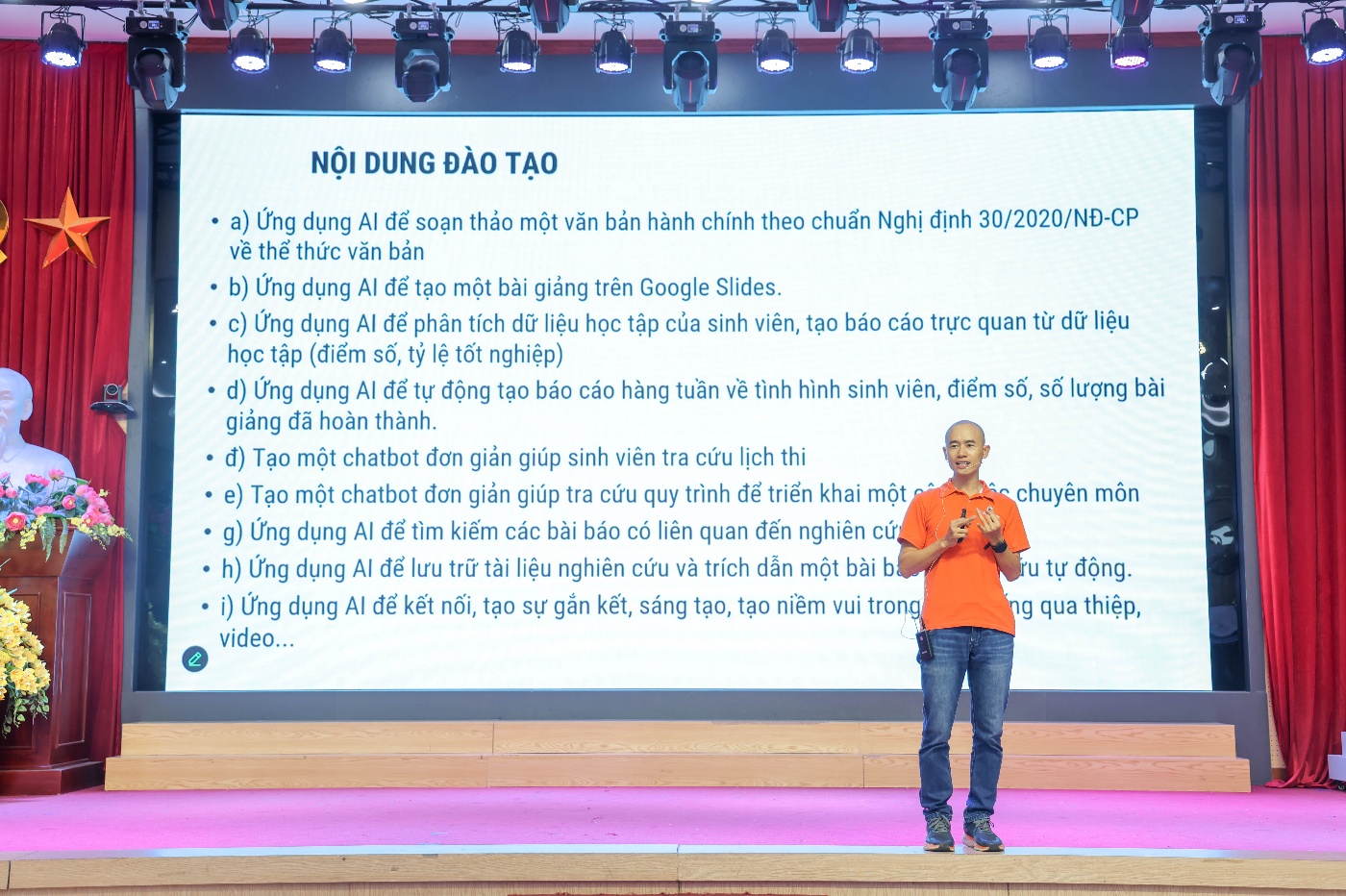 A person standing on a stage Description automatically generated