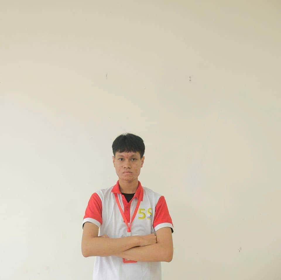 A person standing with his arms crossed AI-generated content may be incorrect.