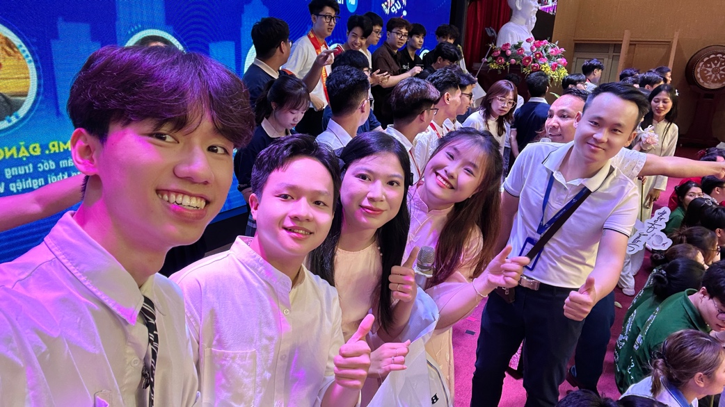 A group of people posing for a photo AI-generated content may be incorrect.