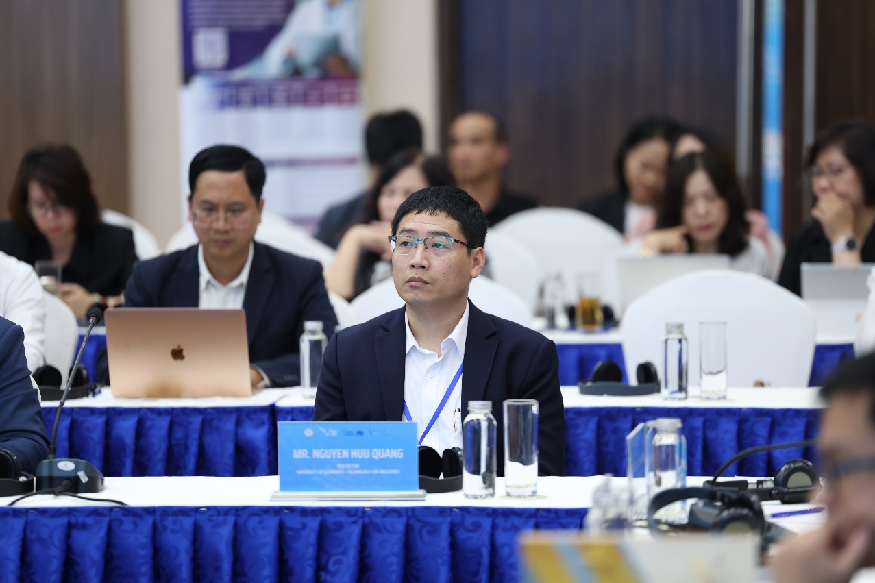 A group of people sitting at tables Description automatically generated