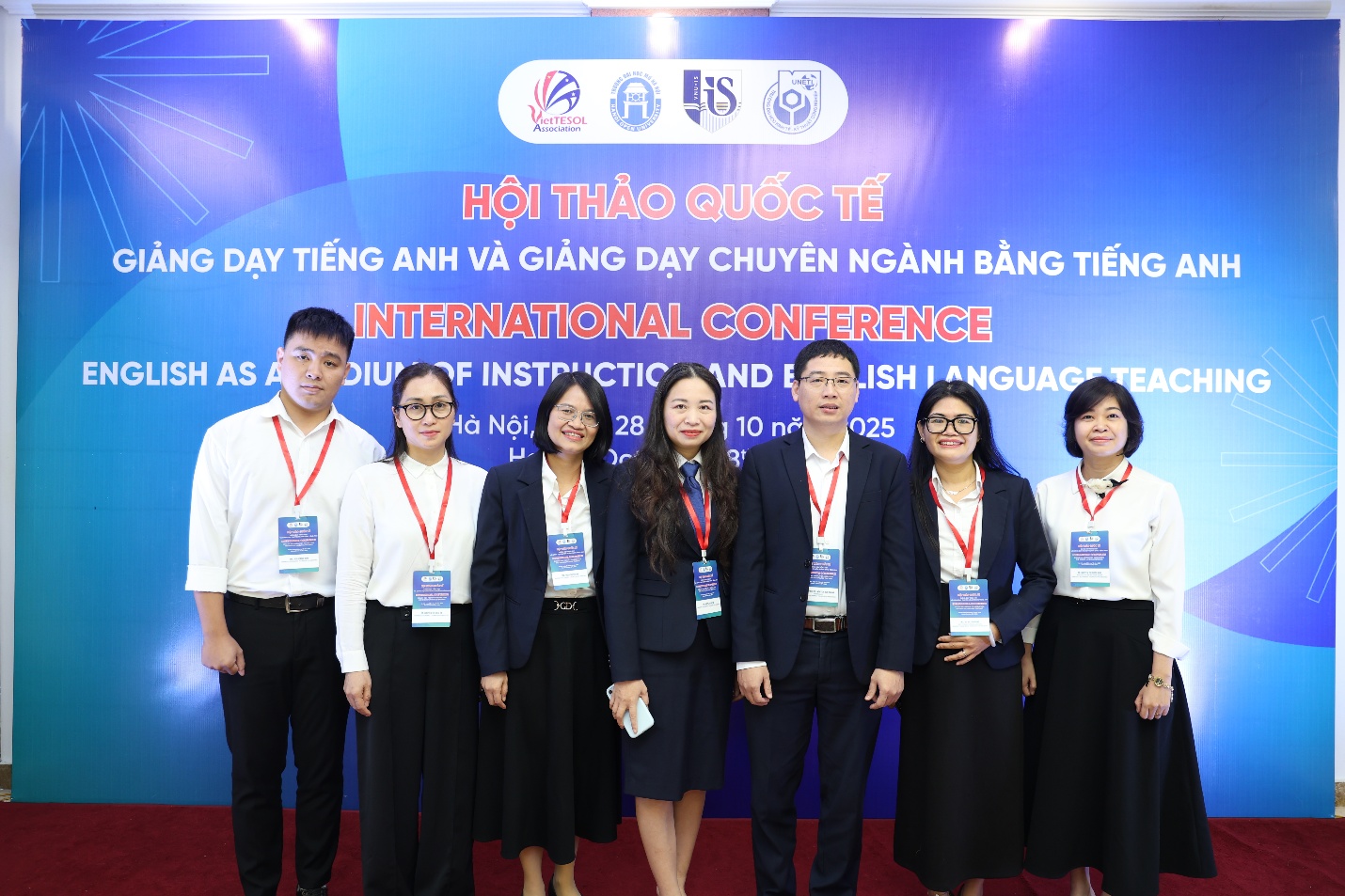 A group of people standing in front of a sign AI-generated content may be incorrect.