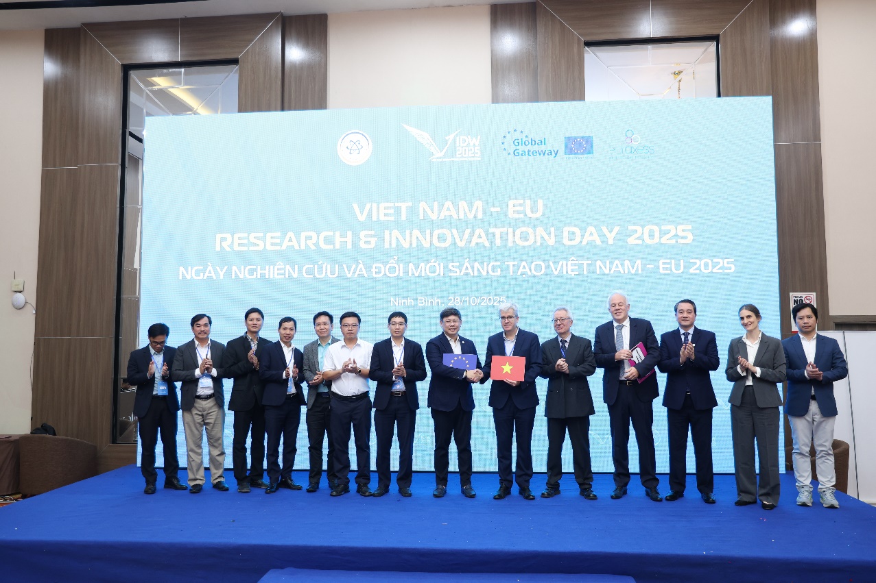 A group of people standing on a stage Description automatically generated