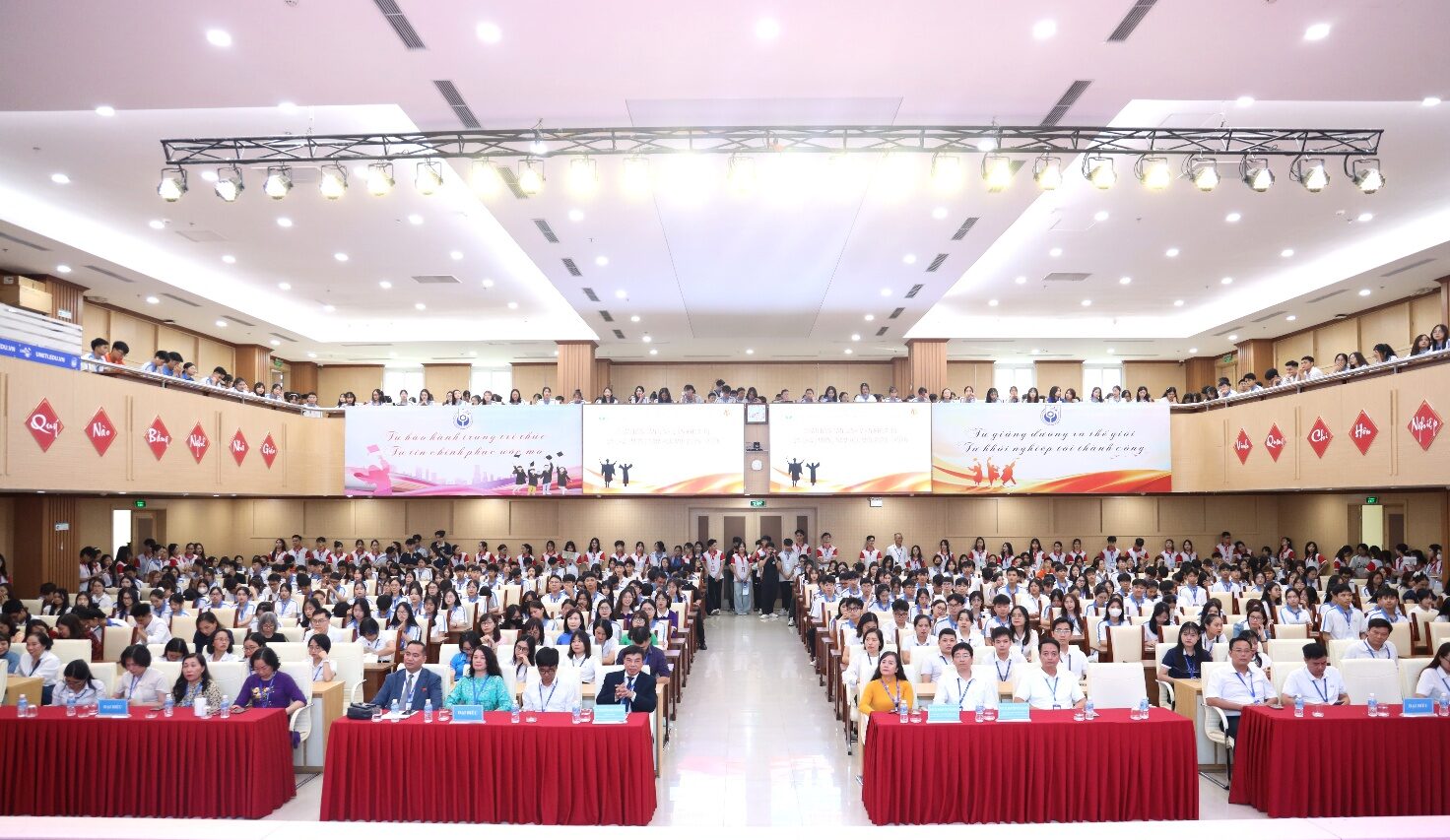 A large group of people in a large room Description automatically generated