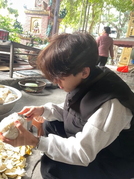 A person cutting food in a bowl AI-generated content may be incorrect.