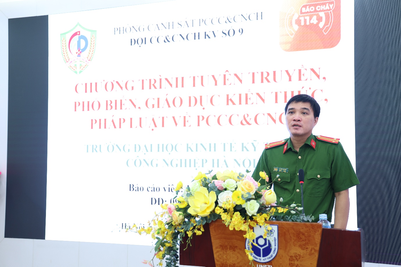 A person in a military uniform standing at a podium

Description automatically generated