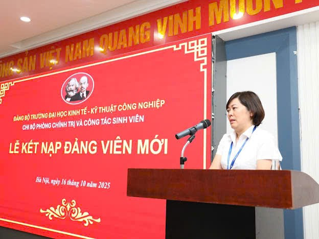 A person standing at a podium with microphones

Description automatically generated