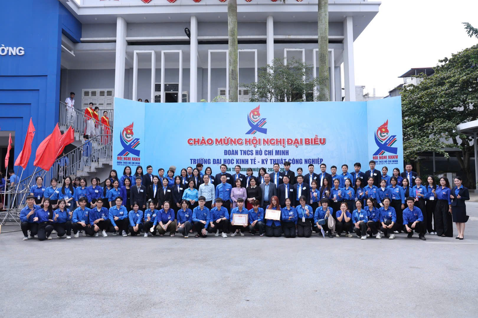 A group of people posing for a photo Description automatically generated