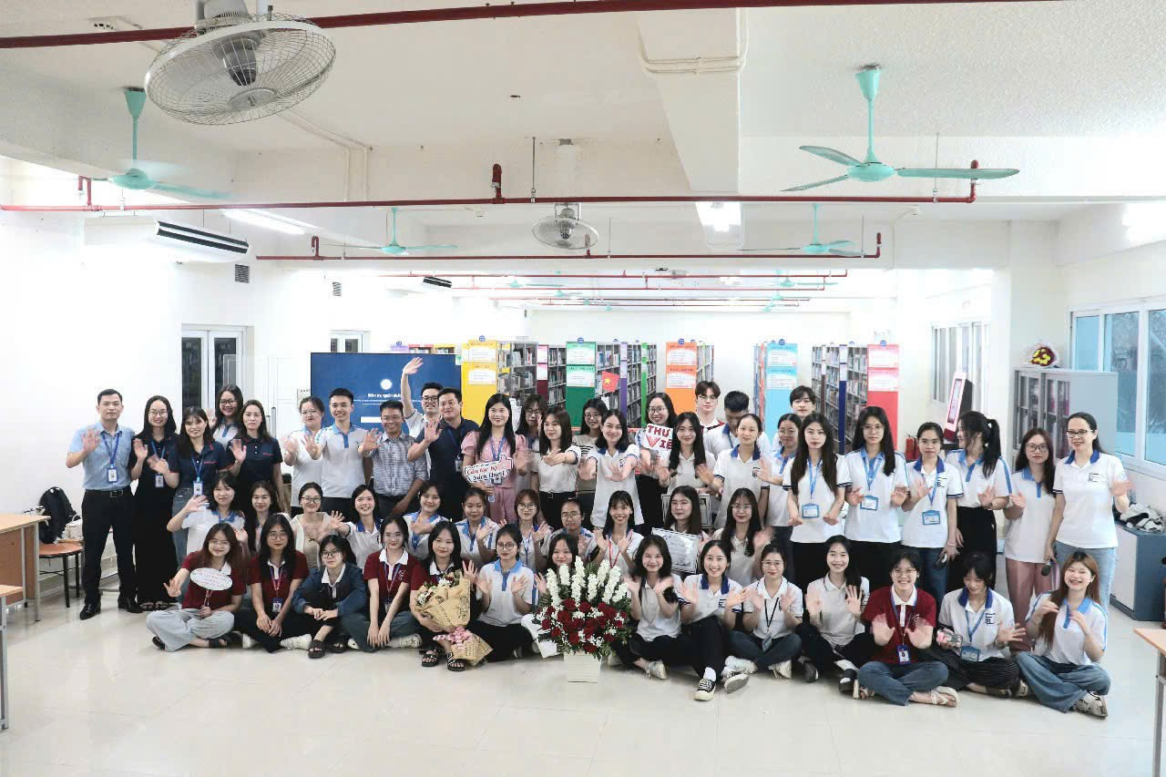 A group of people posing for a photo

Description automatically generated