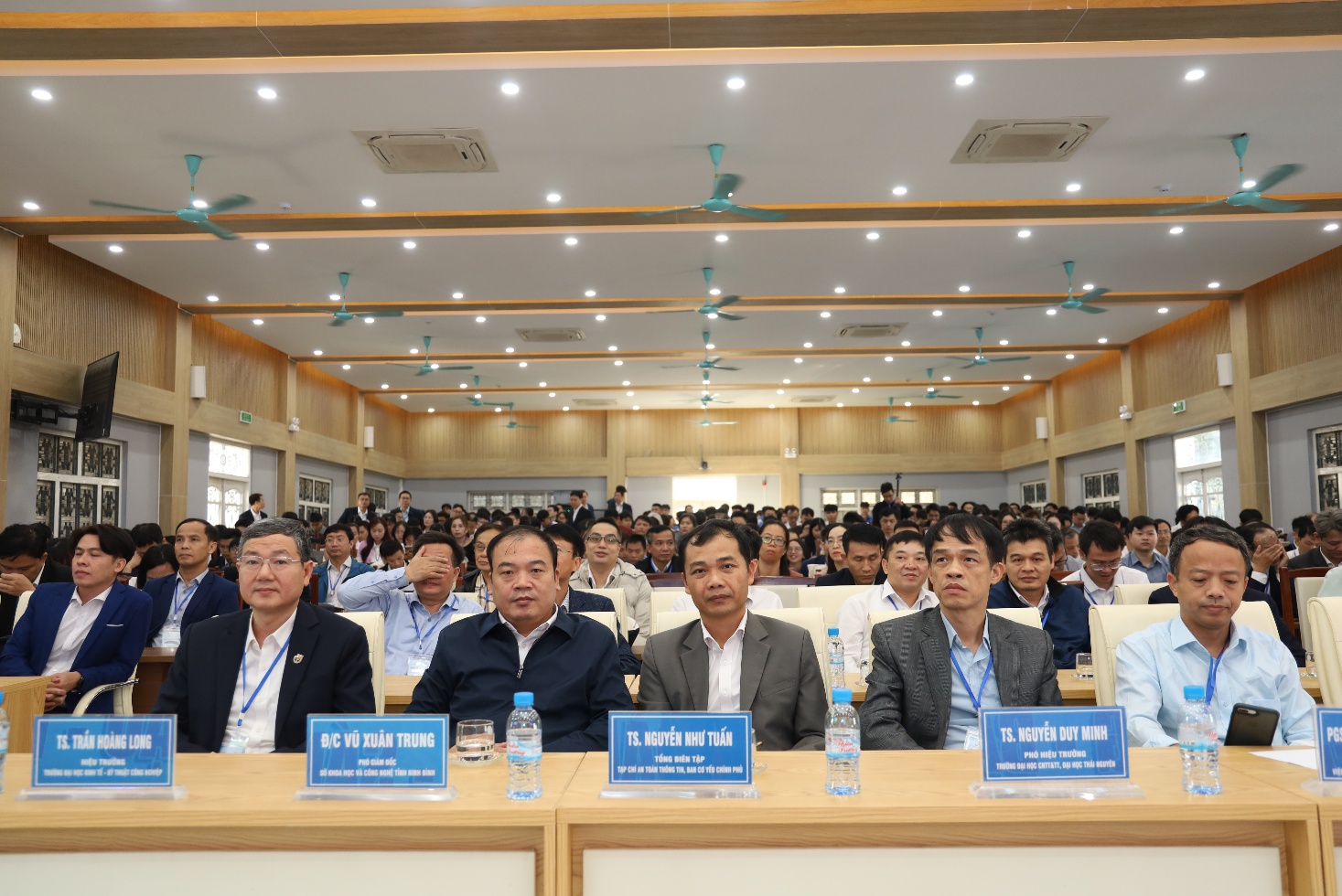 A group of people sitting at a table Description automatically generated