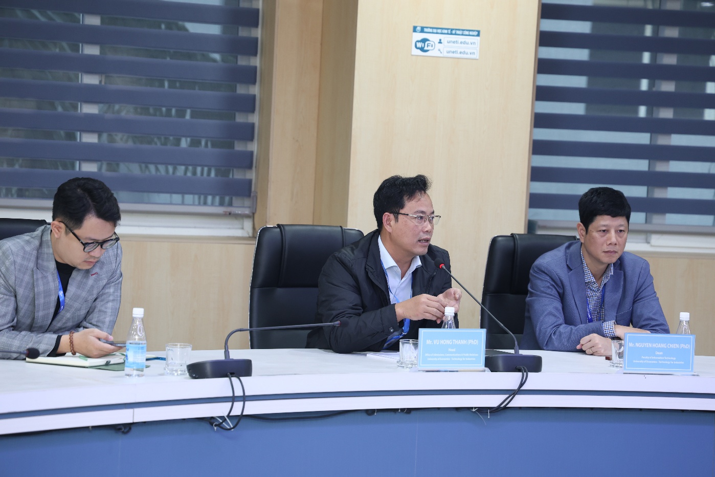 A group of people sitting at a table Description automatically generated