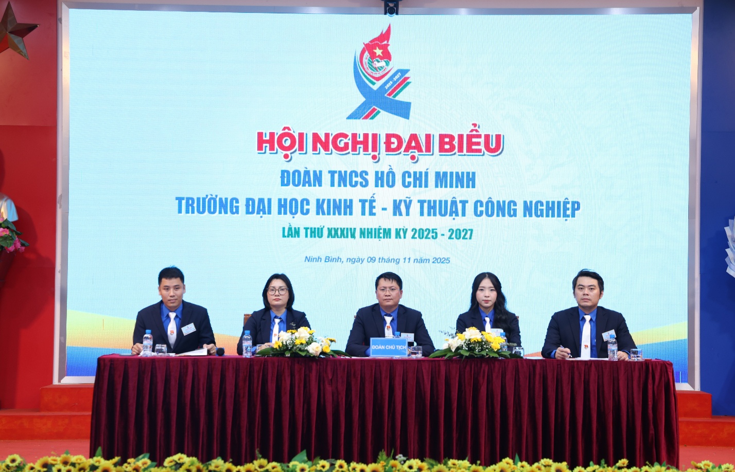 A group of people sitting at a table Description automatically generated