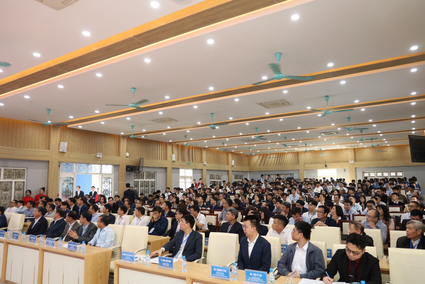 A group of people sitting in a room Description automatically generated