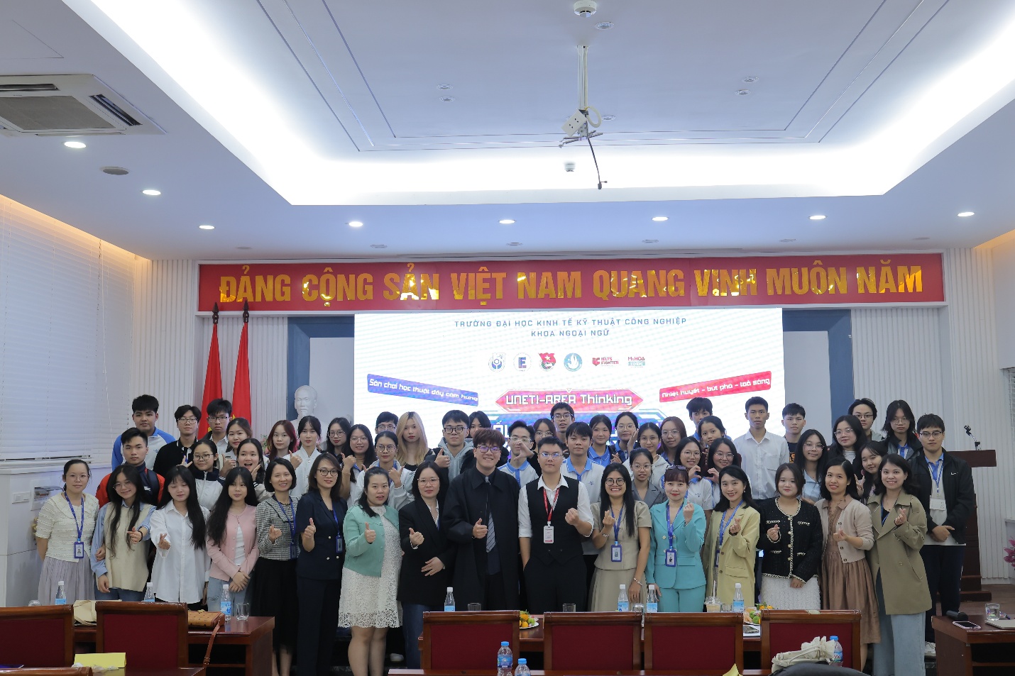 A group of people standing in a room AI-generated content may be incorrect.