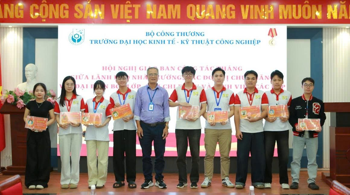 A group of people standing together Description automatically generated