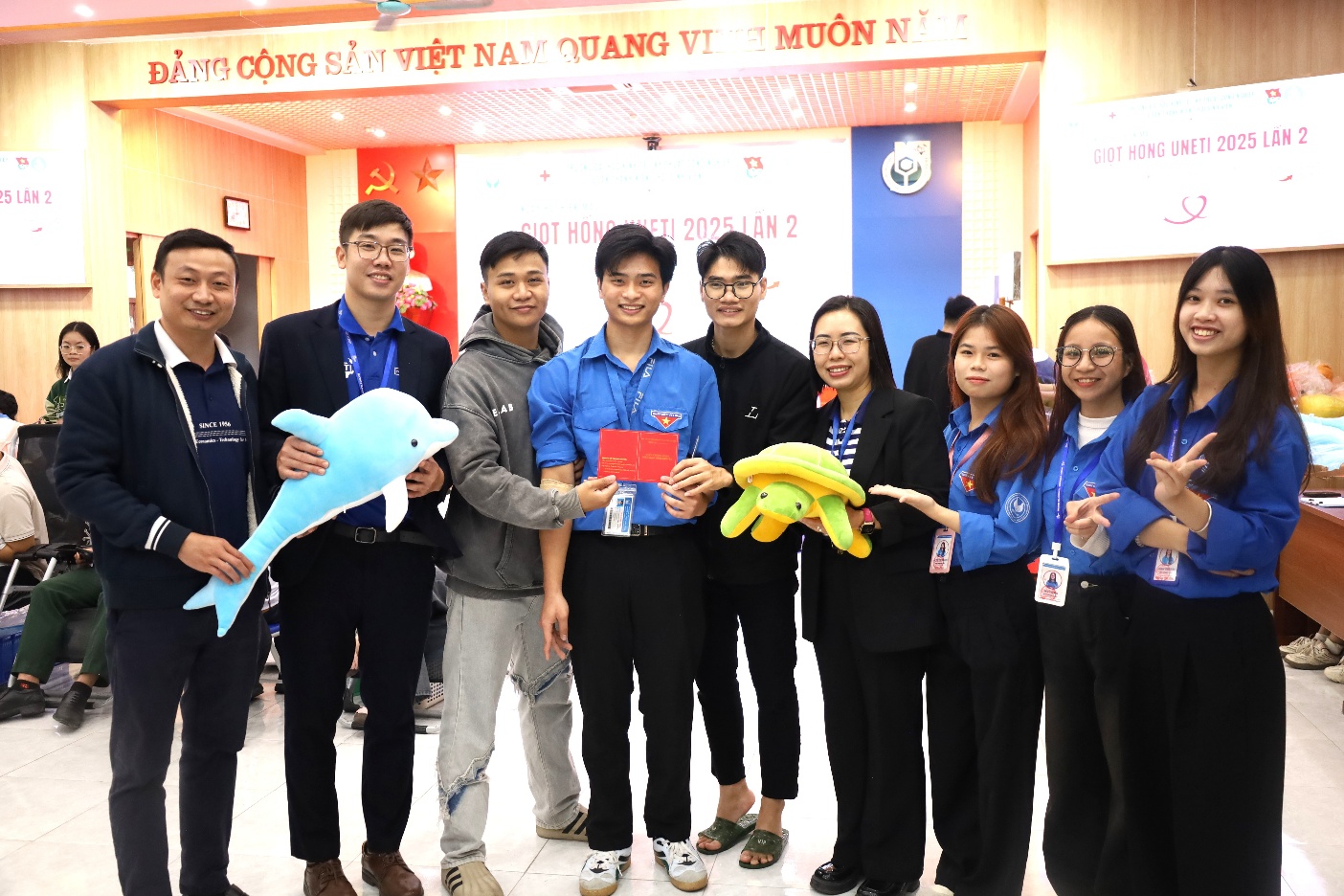 A group of people holding toys

Description automatically generated