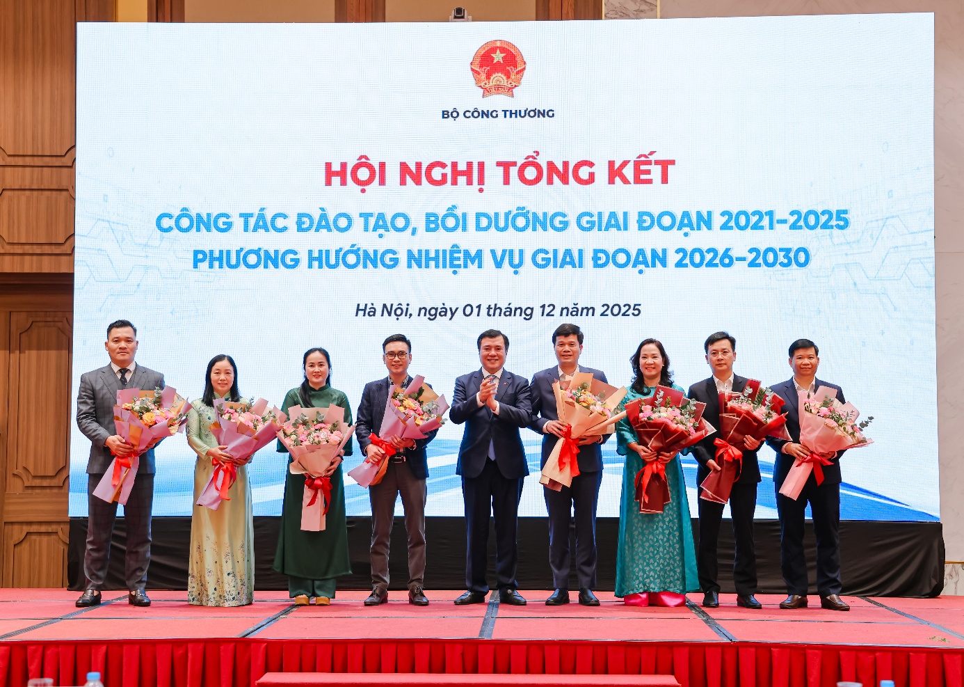 A group of people on a stage Description automatically generated