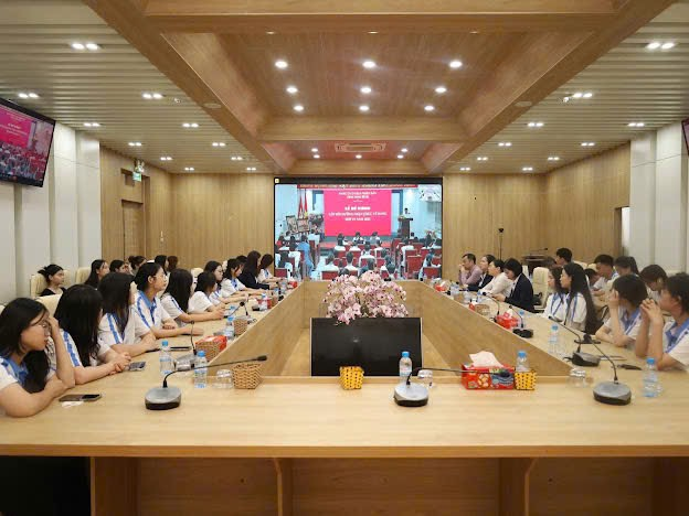 A group of people sitting at a table Description automatically generated