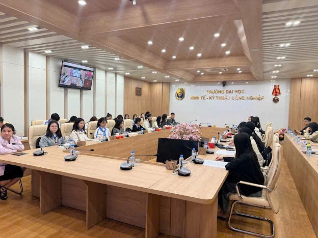 A group of people sitting at a table Description automatically generated