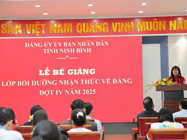 A group of people sitting in chairs in a room Description automatically generated