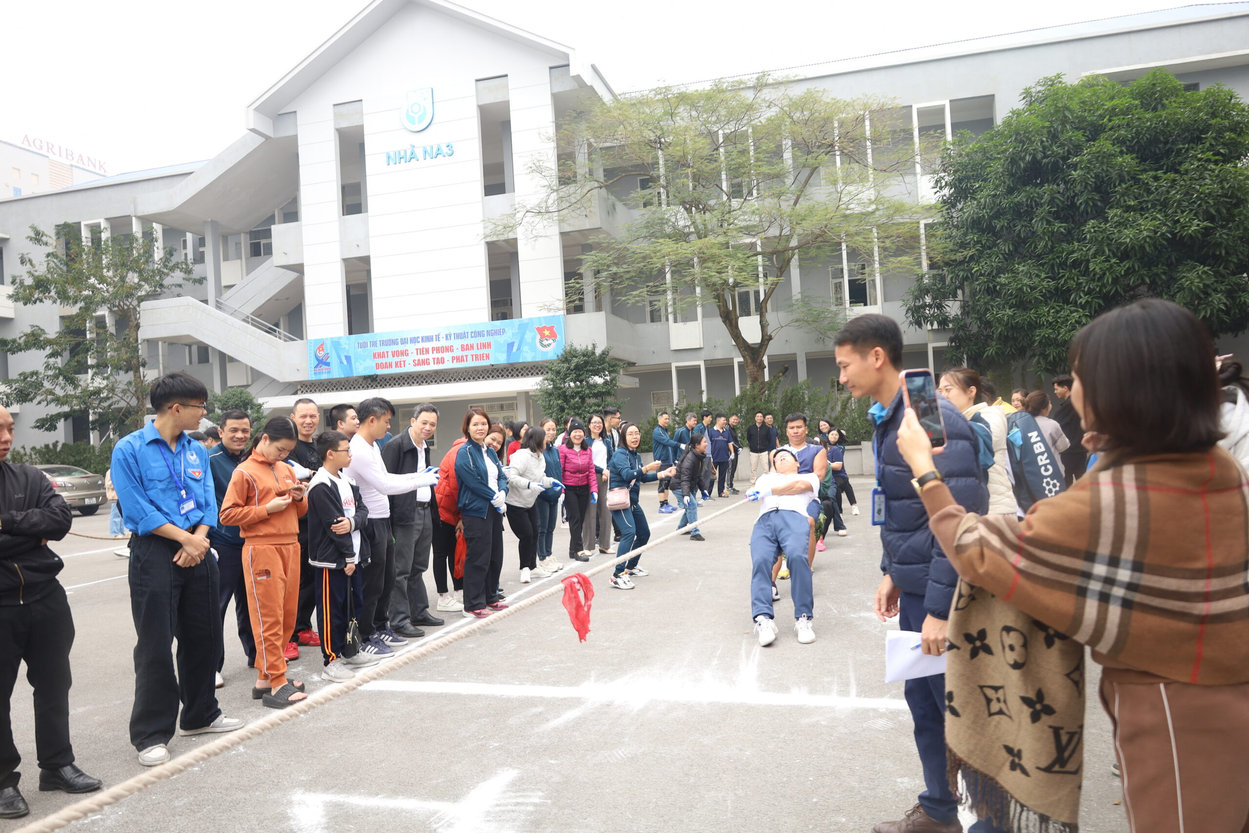 A group of people standing in a line

Description automatically generated