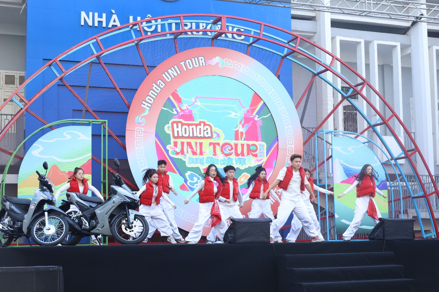 A group of people on a stage Description automatically generated