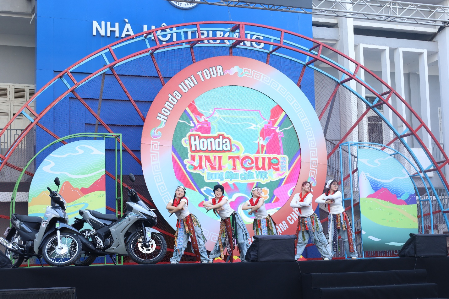 A group of people on a stage Description automatically generated