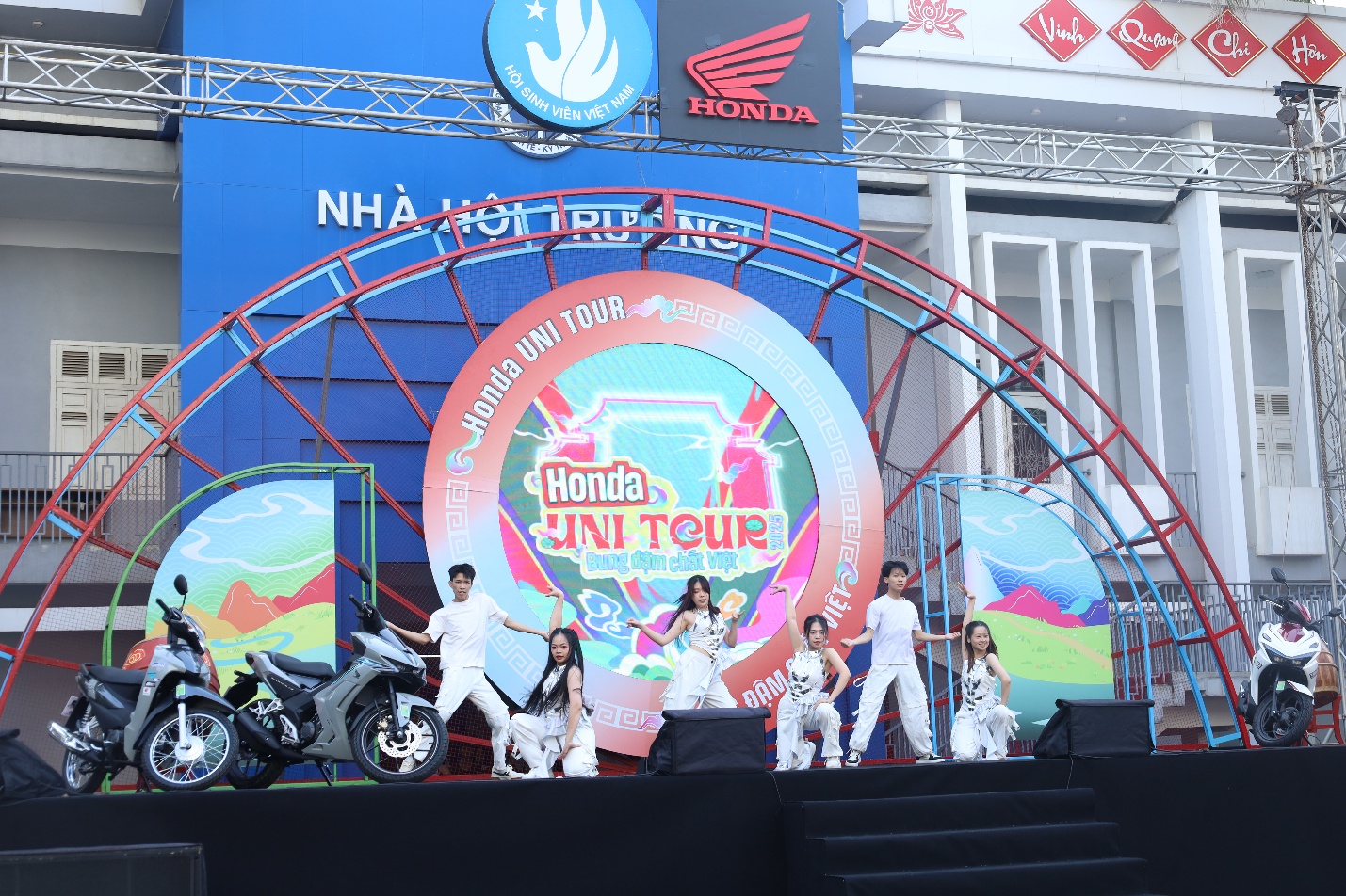 A group of people on a stage Description automatically generated