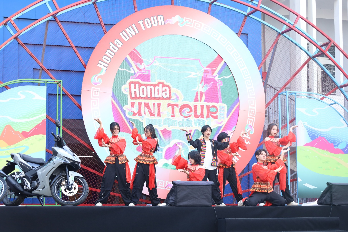 A group of people on a stage Description automatically generated
