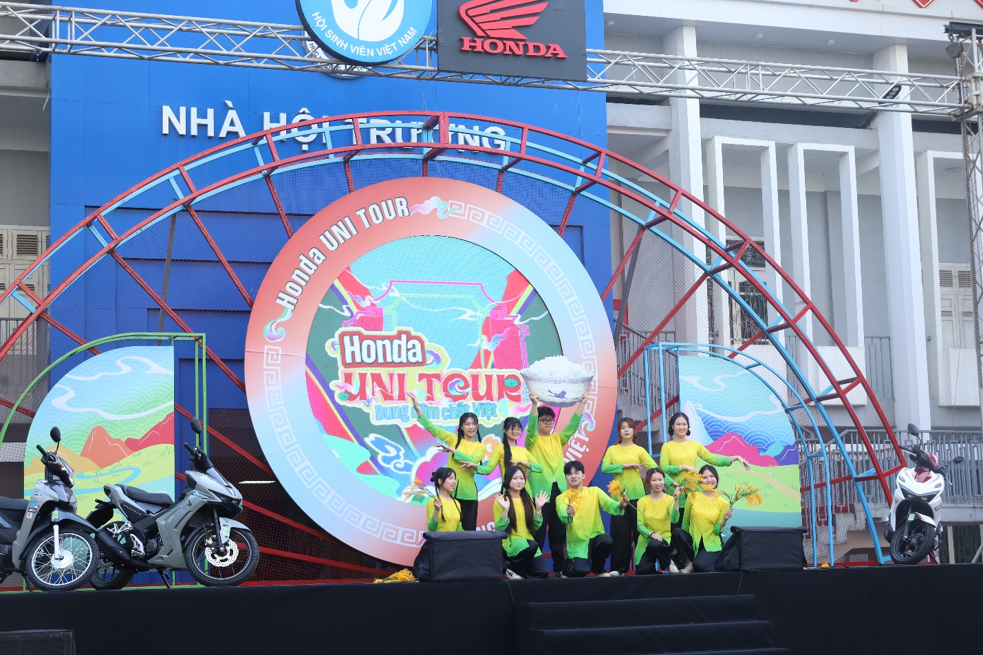 A group of people on a stage Description automatically generated