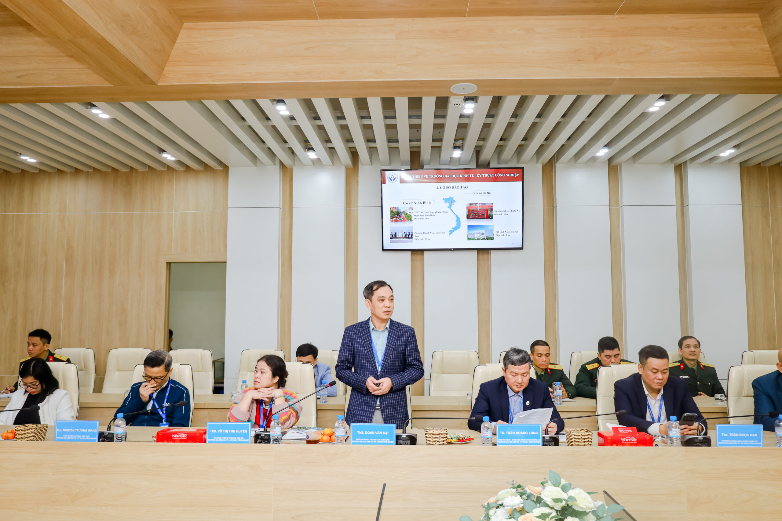 A group of people sitting in a room Description automatically generated