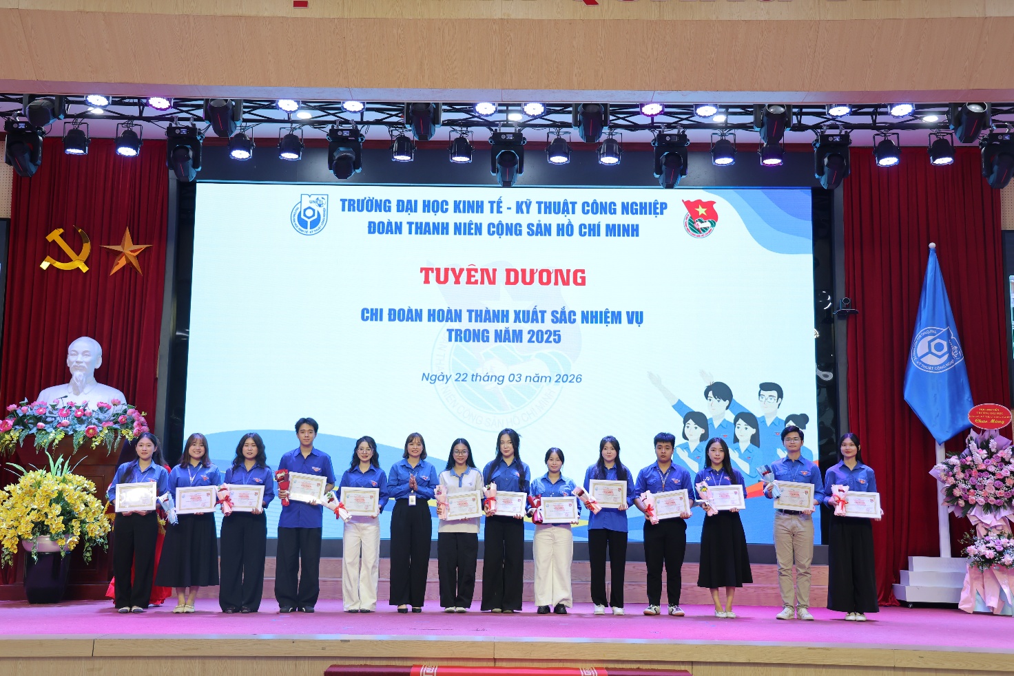 A group of people holding certificates Description automatically generated