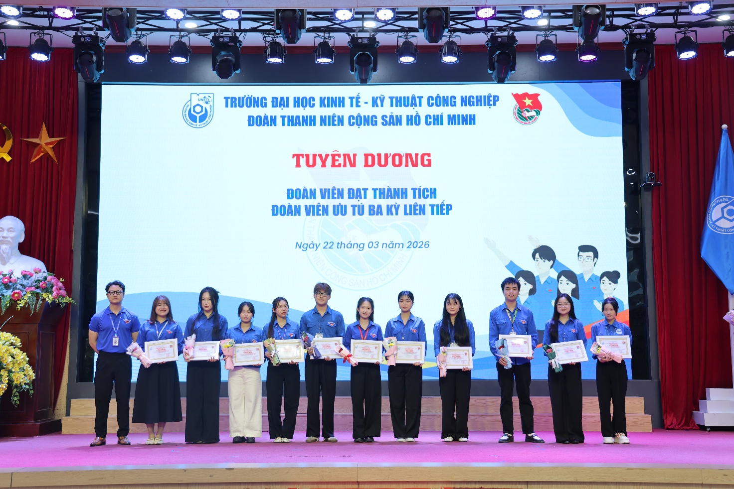 A group of people holding certificates Description automatically generated